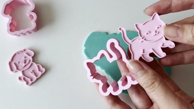 Separate 3D printed cat cookie cutter and embossing stamp