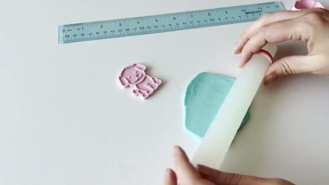 Rolling blue fondant for the cookie cutter and embossing stamp test