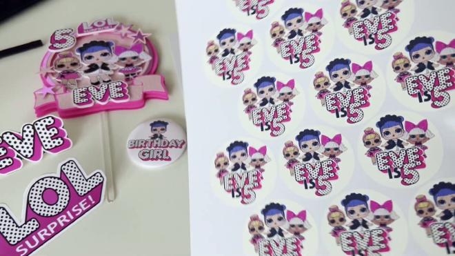 LOL Surprise Eve is 5 birthday stickers next to a matching cake topper and party cutouts