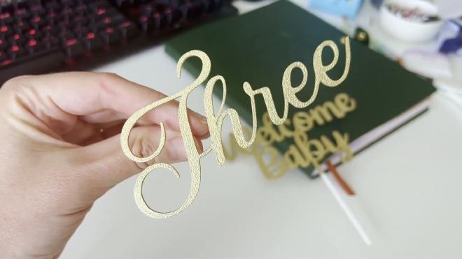 Finished gold Three plaque topper and Welcome Baby topper