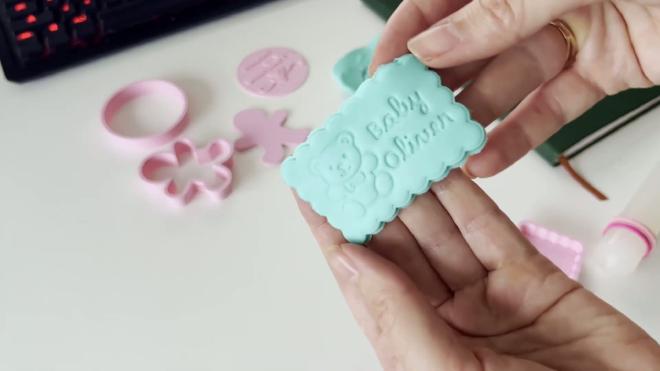 Blue fondant baby shower plaque embossed with a teddy bear and Baby Oliver